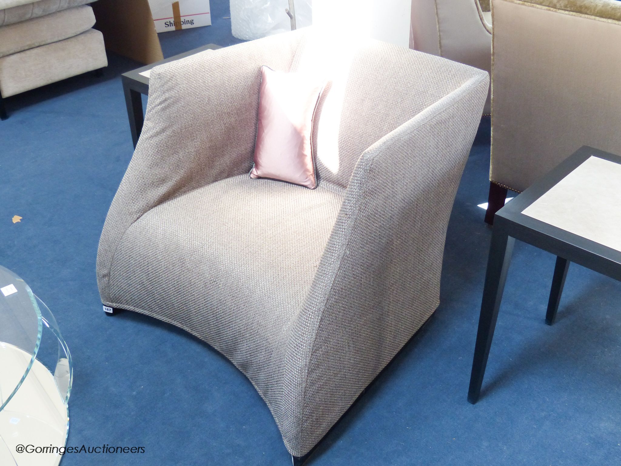 A contemporary upholstered armchair